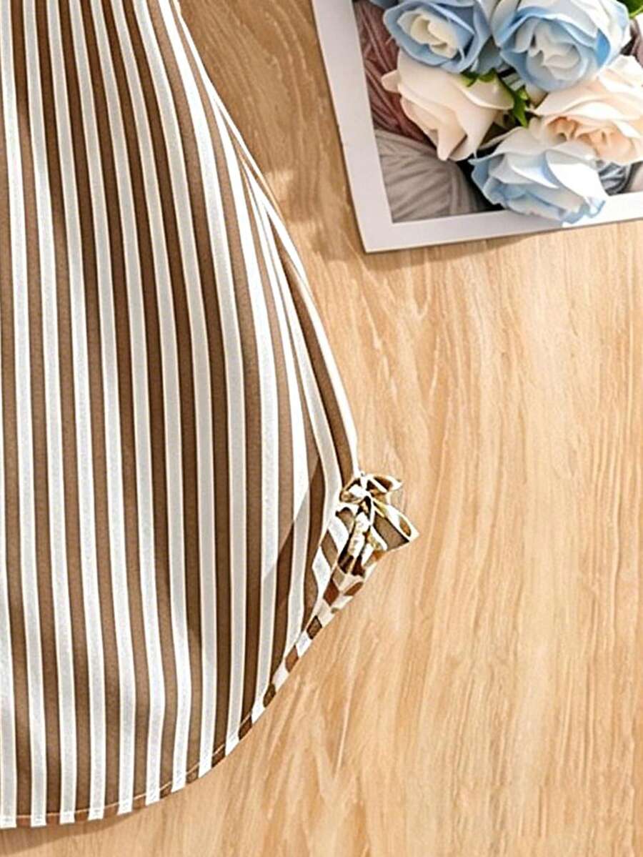 Tween girls blue and white striped casual shirt dress featuring a collared neckline, button front, and flounce sleeves by Left Mama.