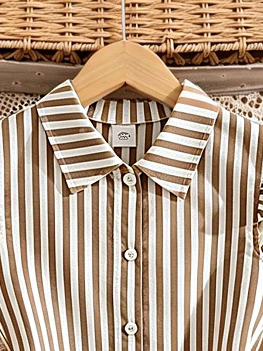 Tween girls blue and white striped casual shirt dress featuring a collared neckline, button front, and flounce sleeves by Left Mama.