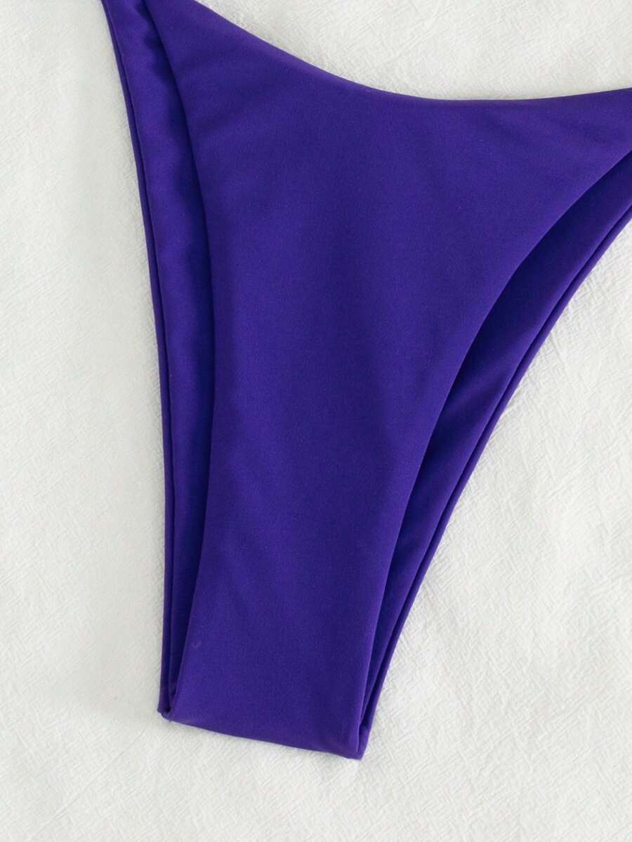 Women's printed halter neck tie two-piece swimwear featuring a wireless triangle top with removable padding and high-waist high-cut bikini bottoms.