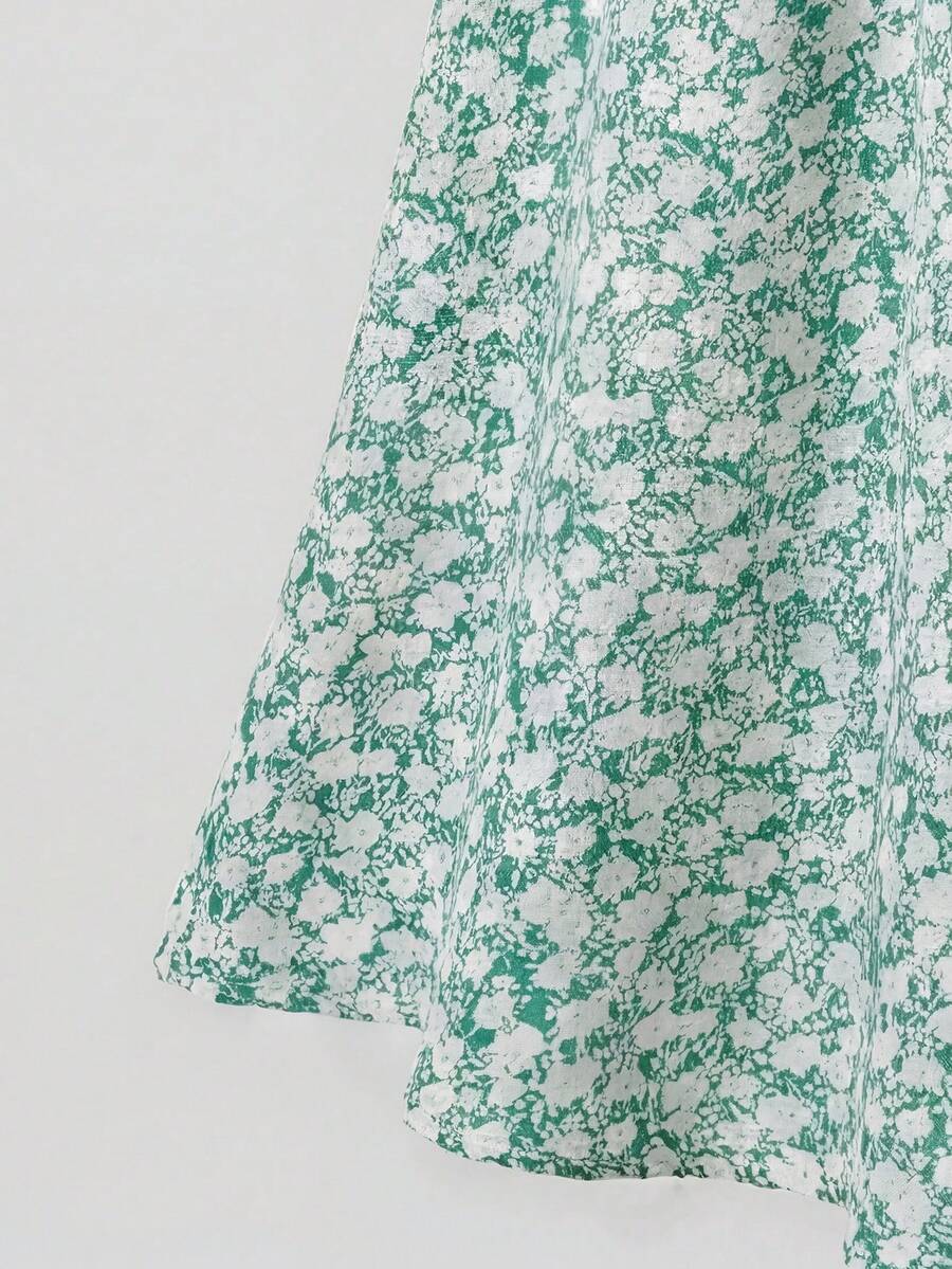 Tween girl wearing an apricot plant print sleeveless A-line long dress with a round neckline and flared skirt.