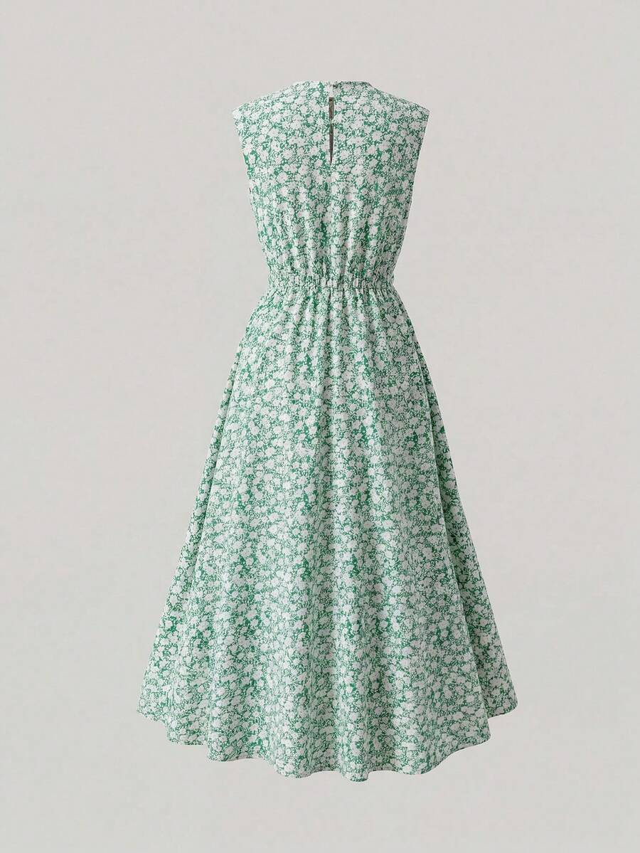 Tween girl wearing an apricot plant print sleeveless A-line long dress with a round neckline and flared skirt.
