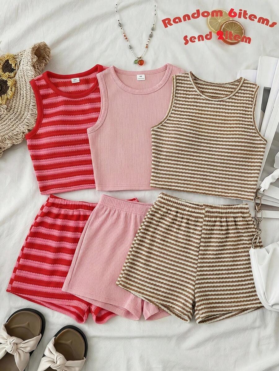 Tween girls black and white two-piece casual summer outfit featuring a rib-knit cropped top with round neck and matching shorts with contrast piping.