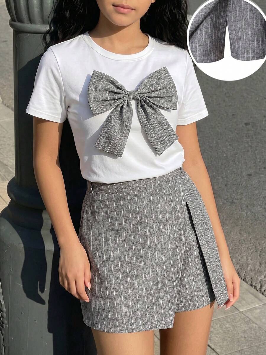 Tween girls 2-piece blue outfit featuring a short sleeve round neck t-shirt with a bow front detail and an asymmetric wrap skort.
