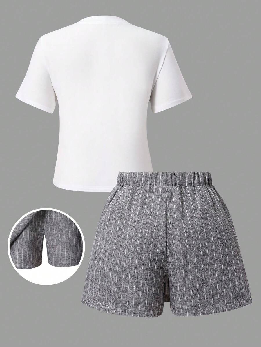 Tween girls 2-piece blue outfit featuring a short sleeve round neck t-shirt with a bow front detail and an asymmetric wrap skort.