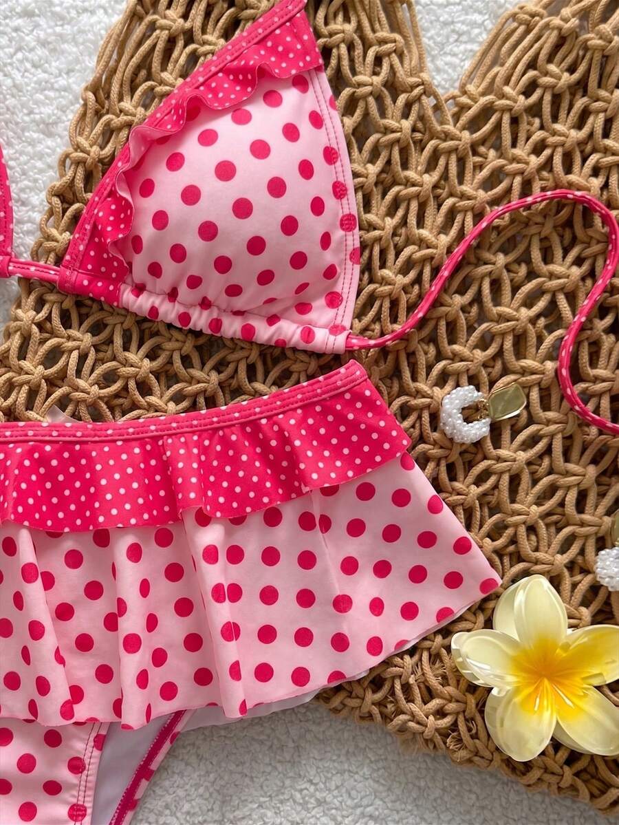 Women's ruffled halter two-piece bikini set with low waist bottoms and wireless triangle cups.