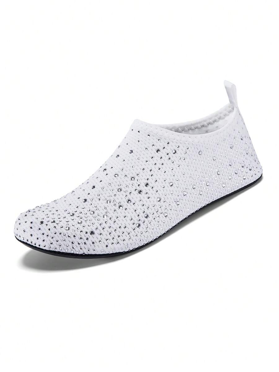 White children's slip-on water shoes with breathable mesh upper, soft EVA insole, non-slip TPR outsole, and rhinestone accent.