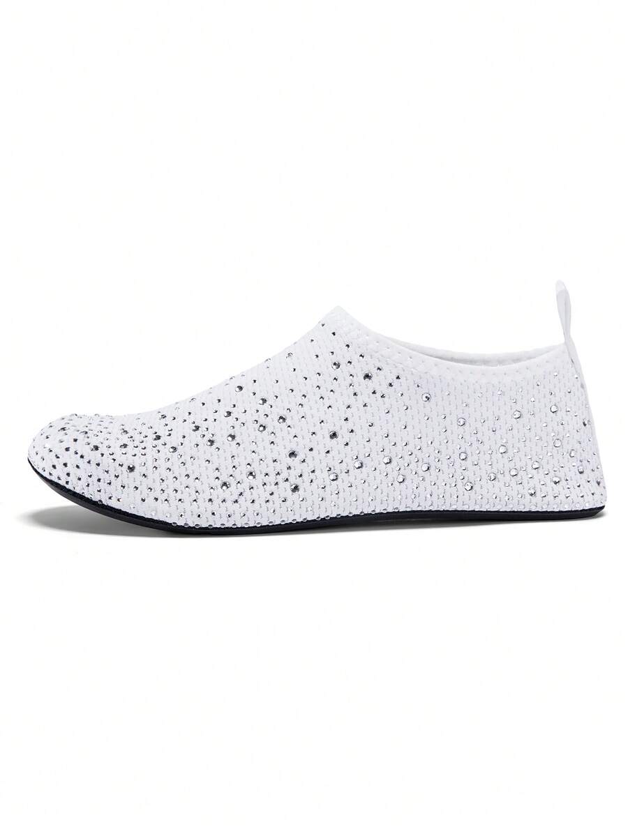 White children's slip-on water shoes with breathable mesh upper, soft EVA insole, non-slip TPR outsole, and rhinestone accent.