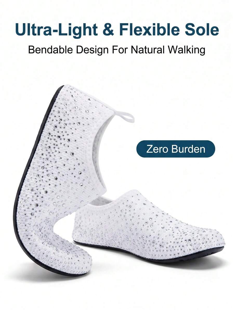 White children's slip-on water shoes with breathable mesh upper, soft EVA insole, non-slip TPR outsole, and rhinestone accent.