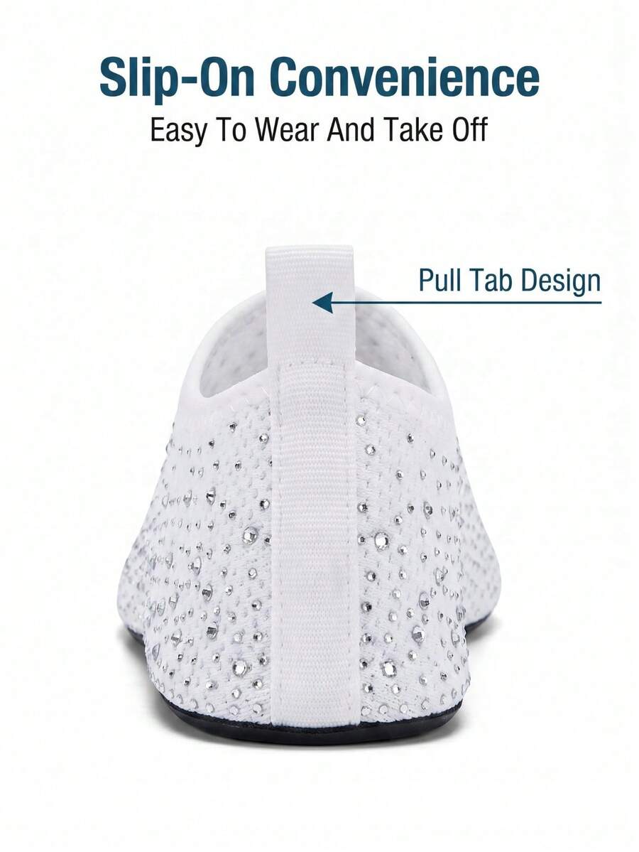 White children's slip-on water shoes with breathable mesh upper, soft EVA insole, non-slip TPR outsole, and rhinestone accent.