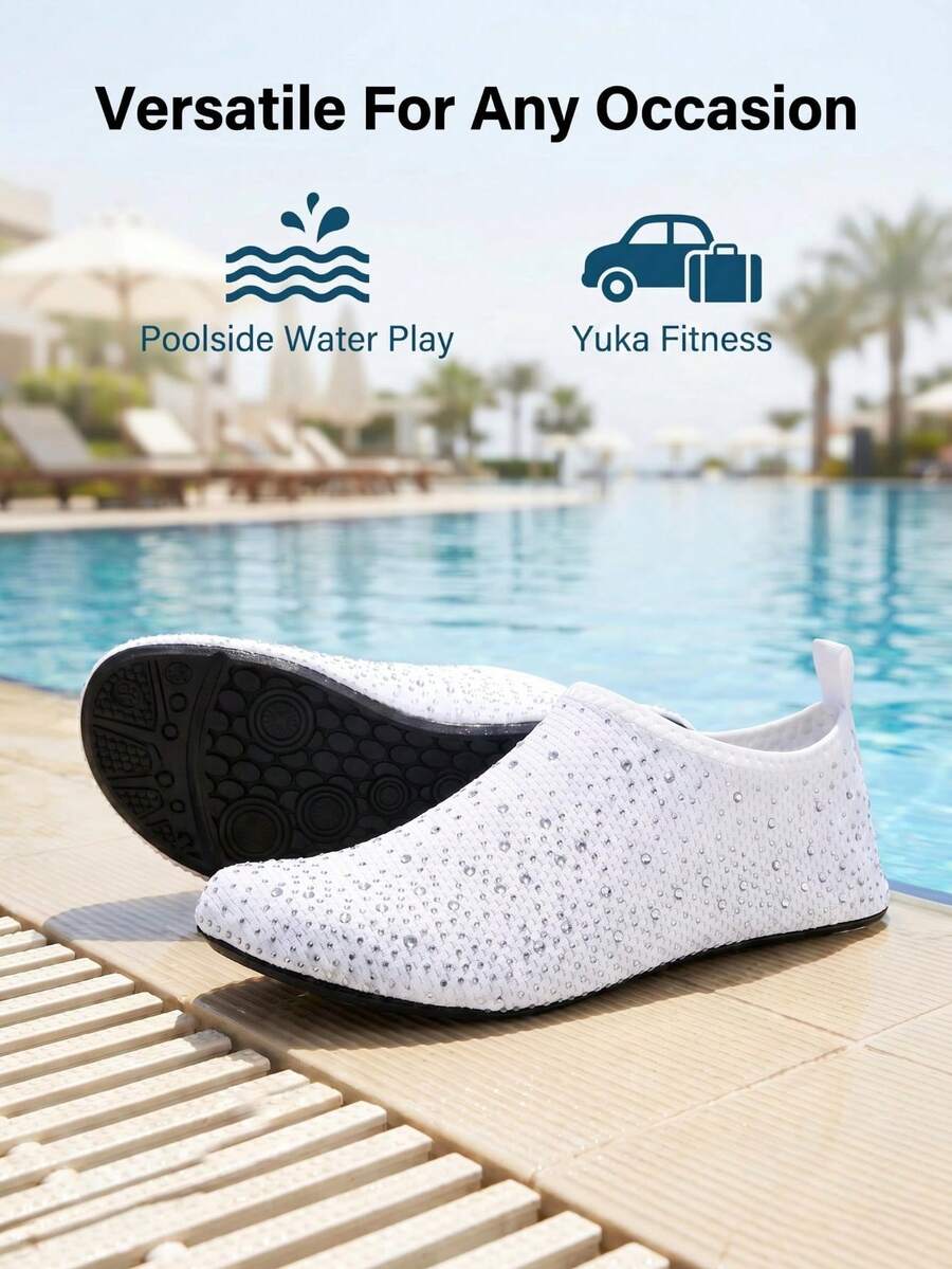 White children's slip-on water shoes with breathable mesh upper, soft EVA insole, non-slip TPR outsole, and rhinestone accent.
