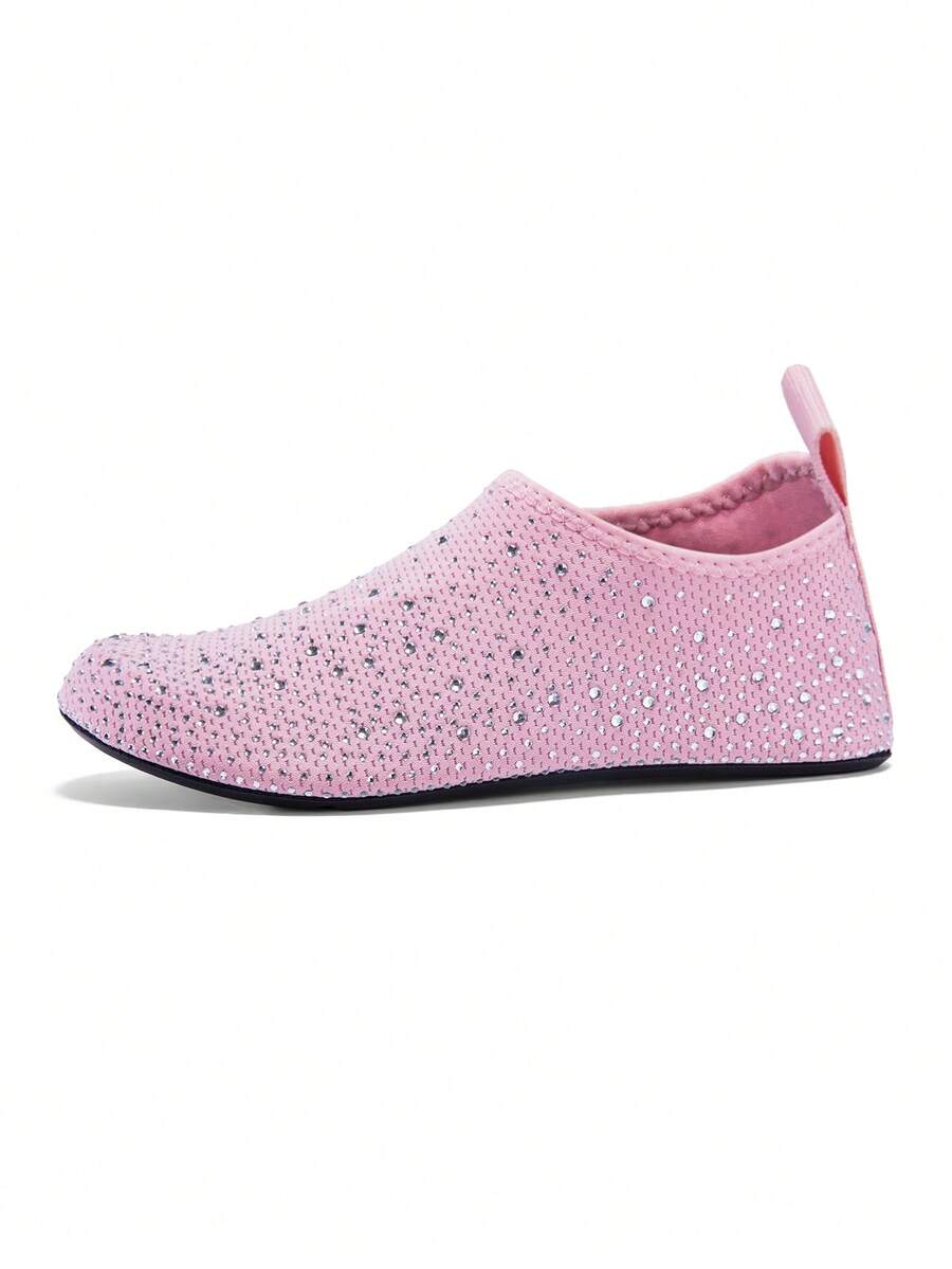 White children's slip-on water shoes with breathable mesh upper, soft EVA insole, non-slip TPR outsole, and rhinestone accent.