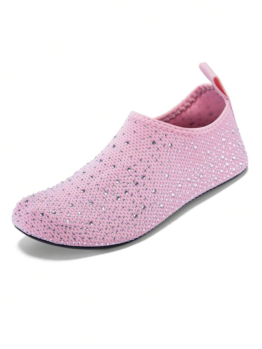 White children's slip-on water shoes with breathable mesh upper, soft EVA insole, non-slip TPR outsole, and rhinestone accent.