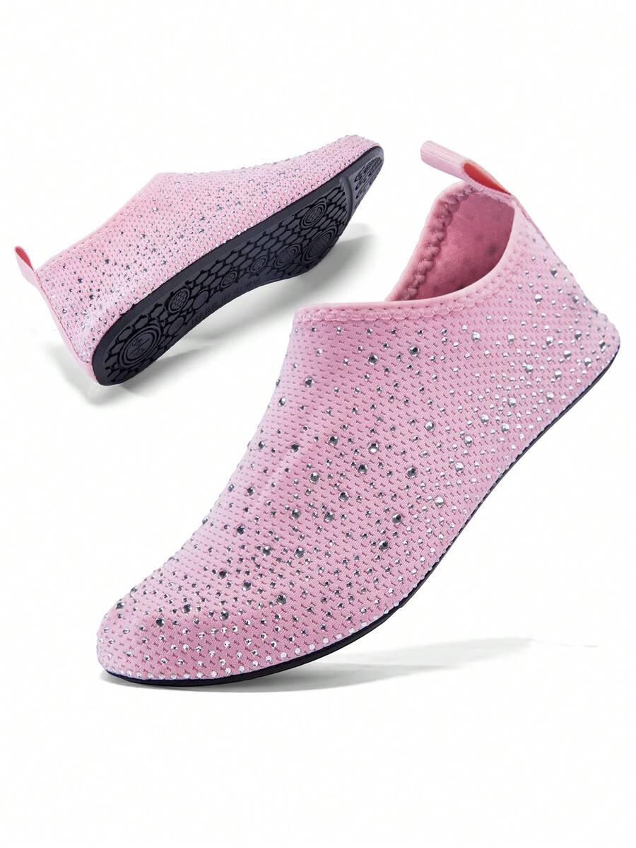 White children's slip-on water shoes with breathable mesh upper, soft EVA insole, non-slip TPR outsole, and rhinestone accent.