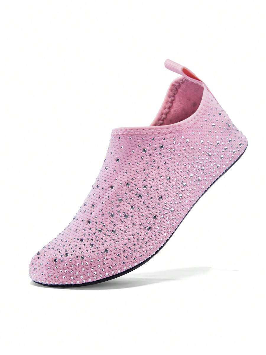 White children's slip-on water shoes with breathable mesh upper, soft EVA insole, non-slip TPR outsole, and rhinestone accent.