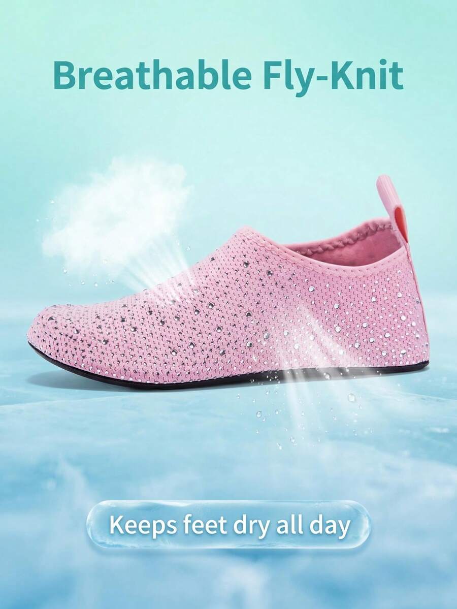 White children's slip-on water shoes with breathable mesh upper, soft EVA insole, non-slip TPR outsole, and rhinestone accent.