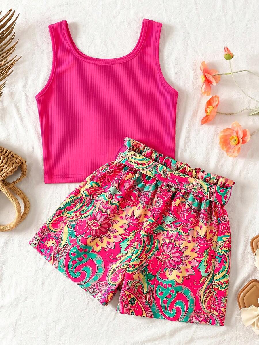 Tween girl wearing a casual 2-piece set featuring a black rib-knit scoop neck tank top and leopard print paperbag waist shorts with a matching belt.