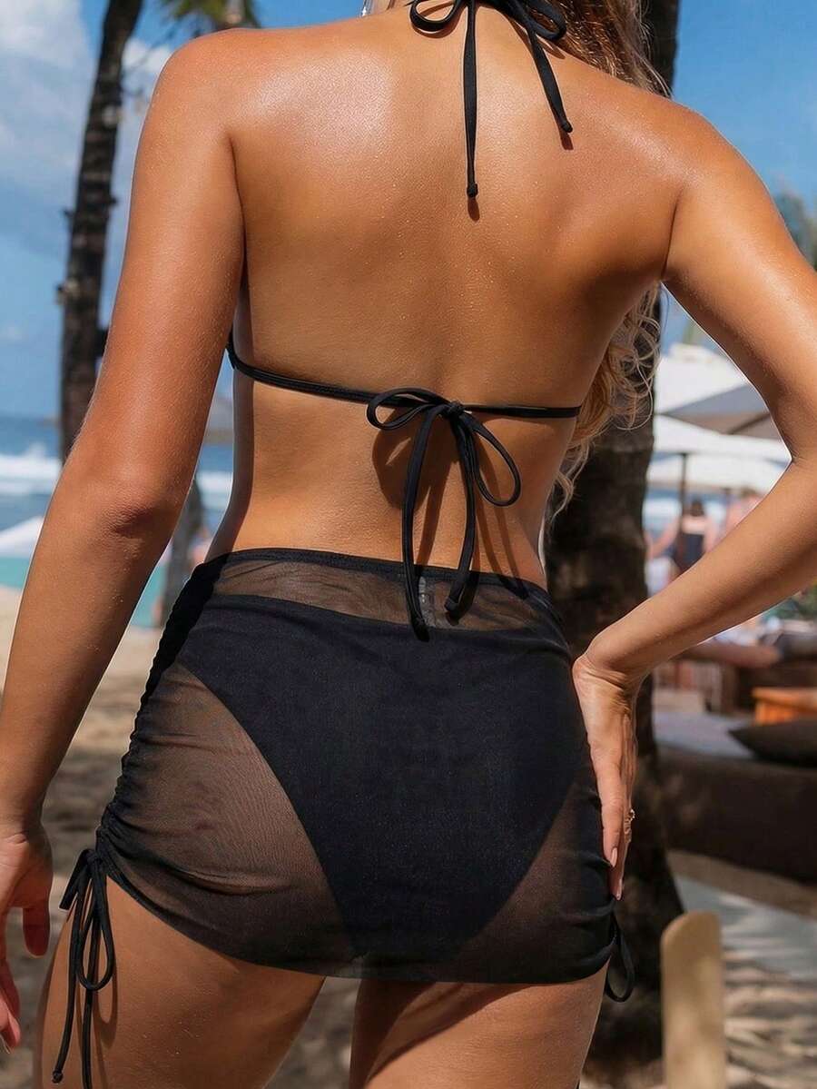 Women's black 3-piece bikini set featuring a halter triangle top with removable padding, high-waisted bottoms, and a knee-length mesh skirt with tie details.