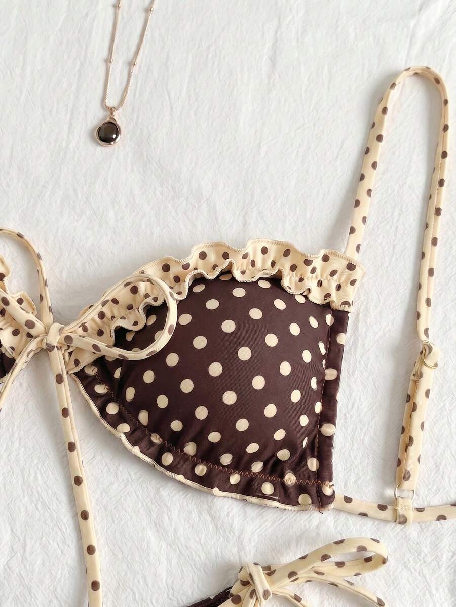 Women's beige two-piece bikini set featuring a wireless top with removable padding, spaghetti straps, tie back detail, and low waist hipster swimsuit bottoms.