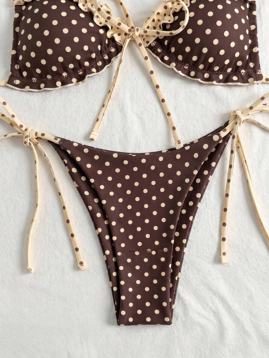 Women's beige two-piece bikini set featuring a wireless top with removable padding, spaghetti straps, tie back detail, and low waist hipster swimsuit bottoms.