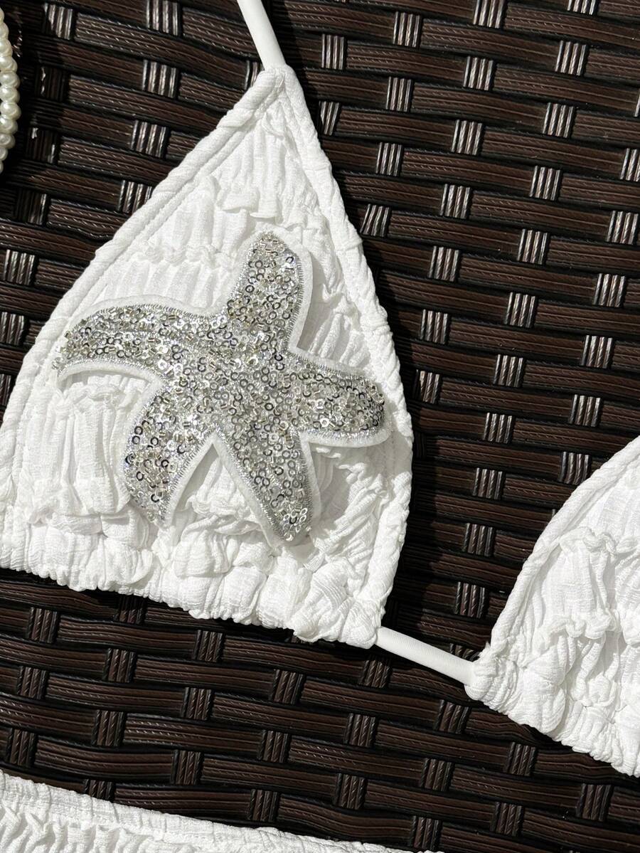 Women's apricot two-piece swimsuit set with a halter tie-back top and matching high stretch shorts.