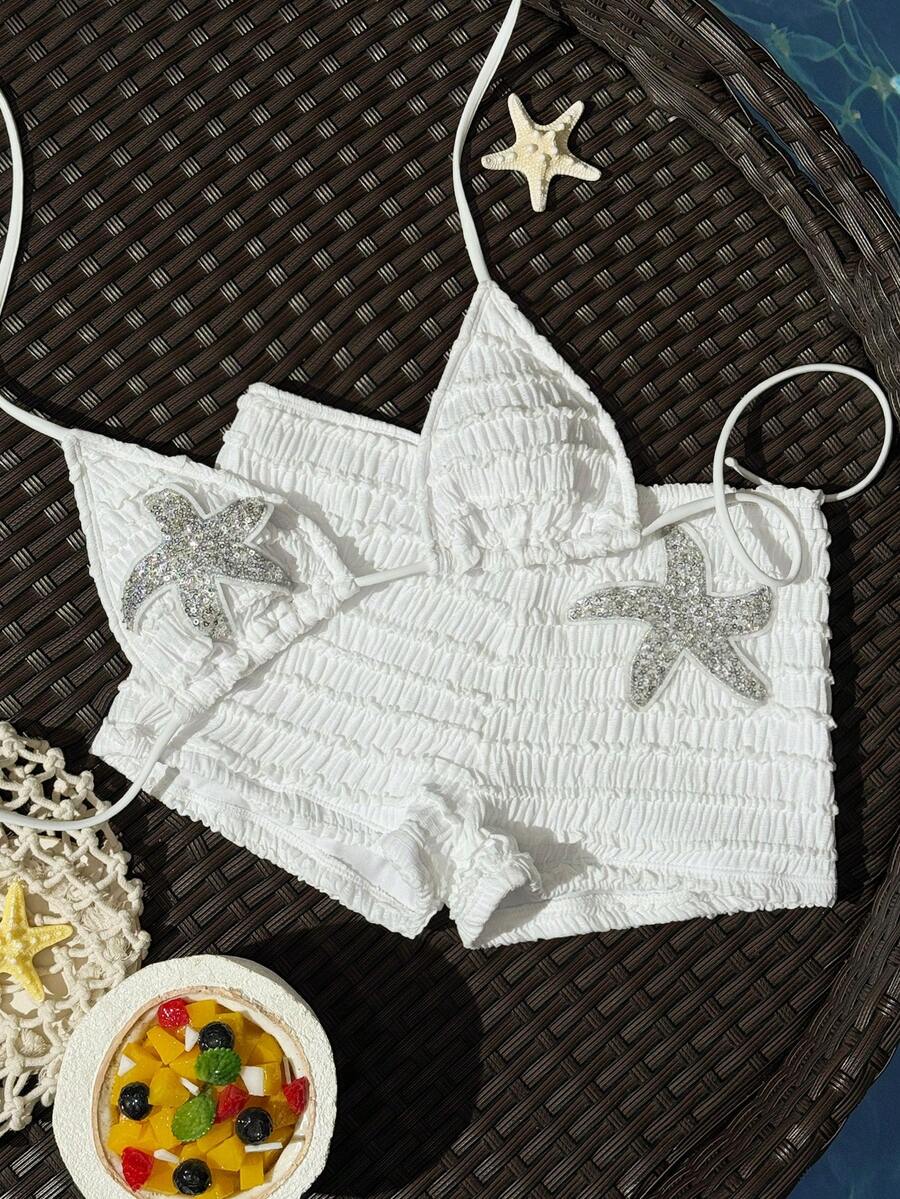 Women's apricot two-piece swimsuit set with a halter tie-back top and matching high stretch shorts.