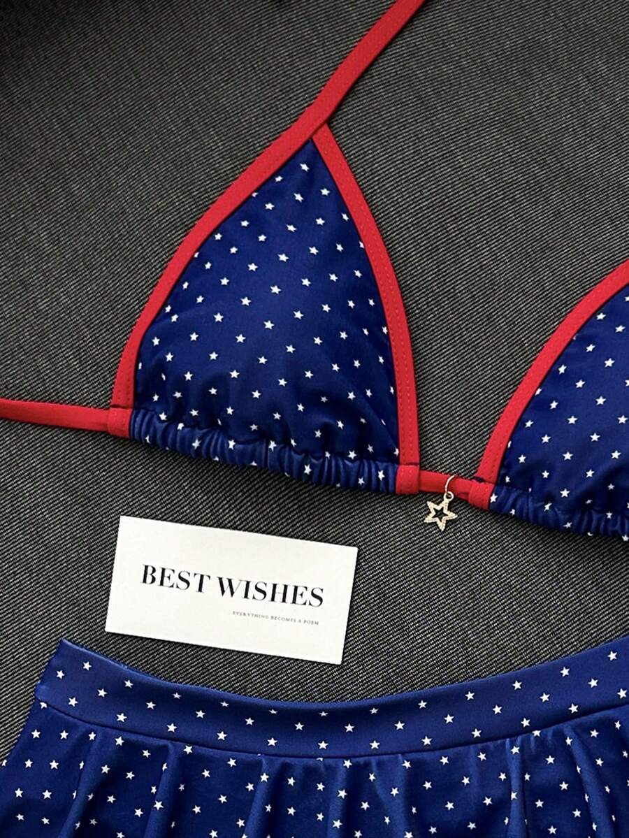 Women's 70s retro black and white polka dot bikini set featuring a halter triangle top and ultra low waist bottoms.