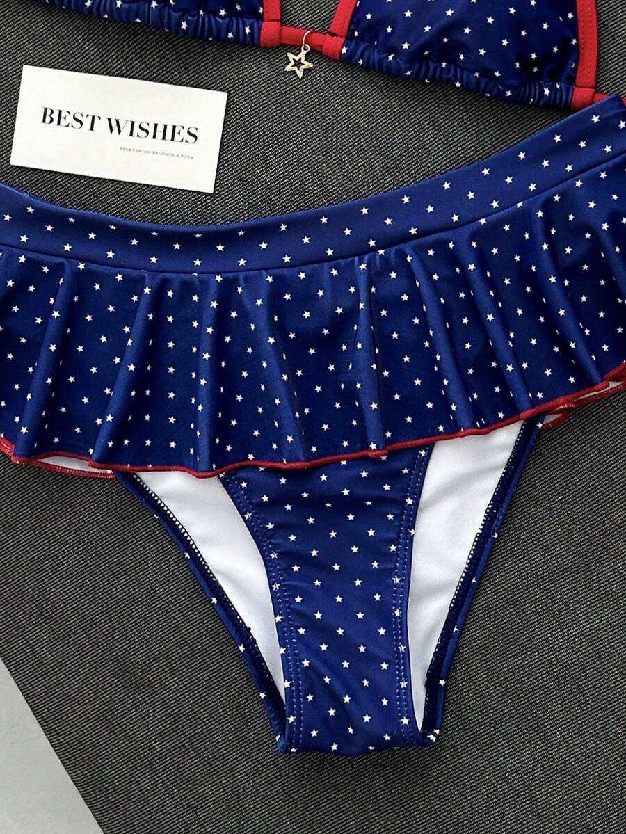 Women's 70s retro black and white polka dot bikini set featuring a halter triangle top and ultra low waist bottoms.