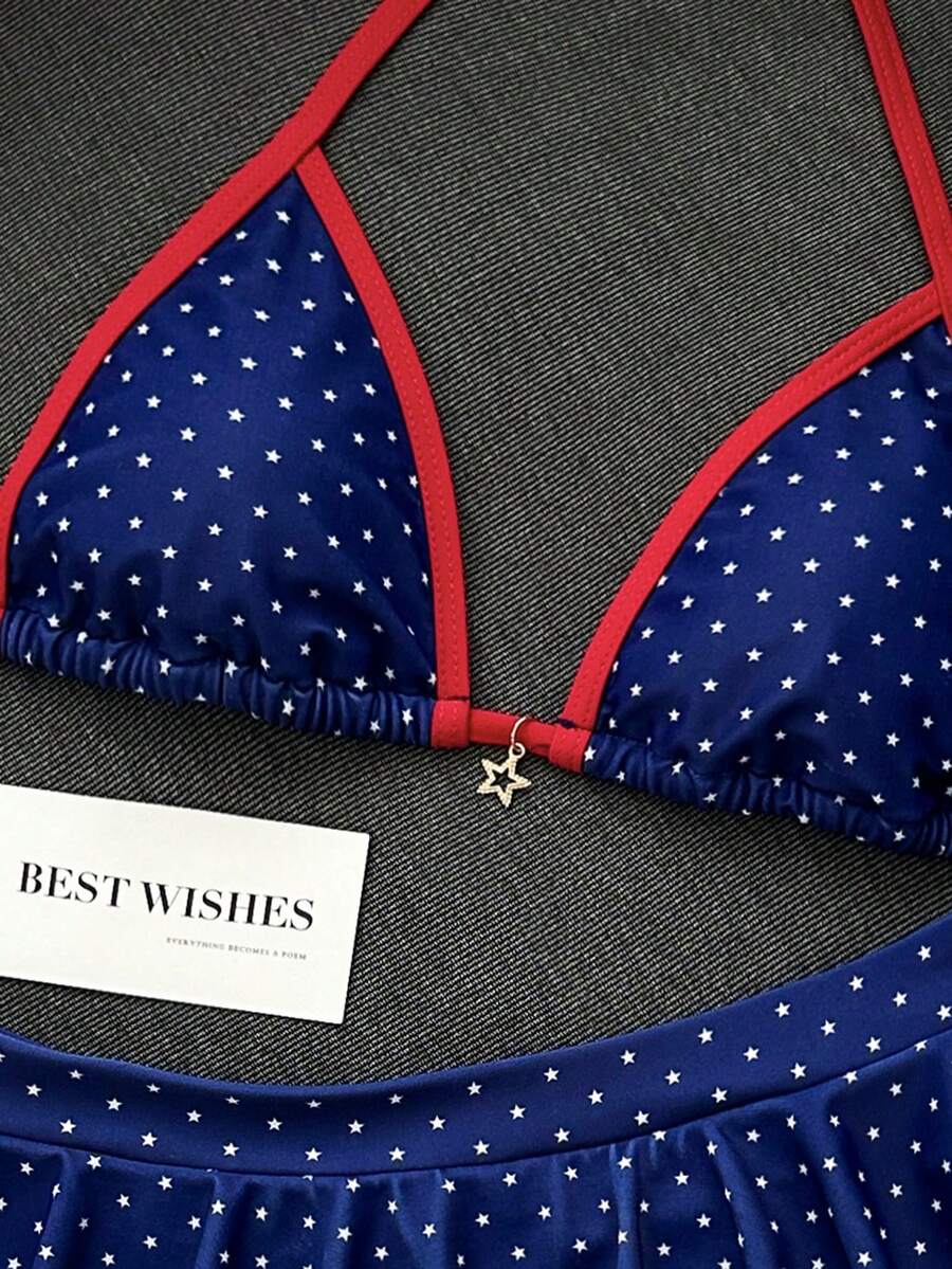 Women's 70s retro black and white polka dot bikini set featuring a halter triangle top and ultra low waist bottoms.