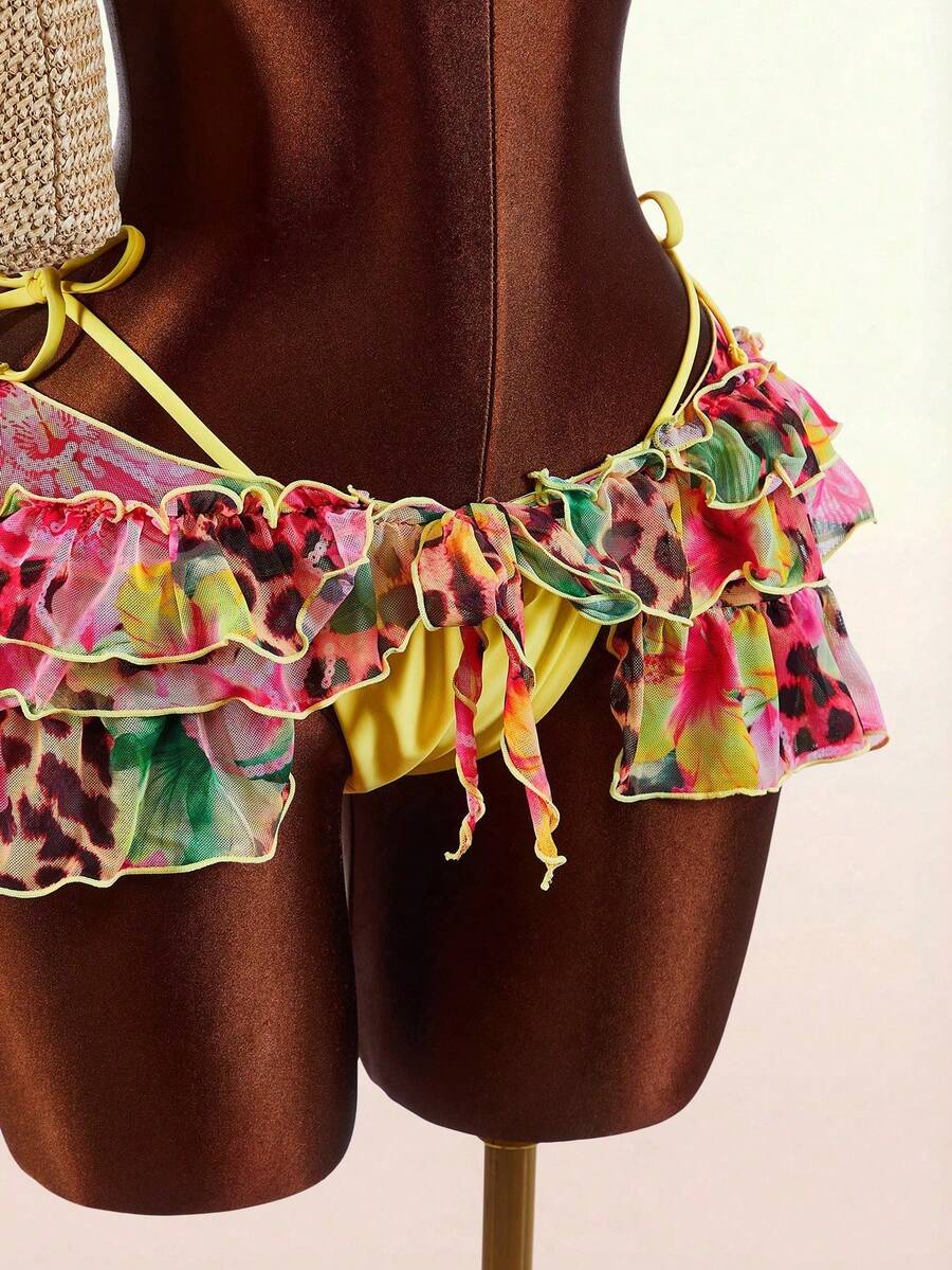 Women's 3-piece blue bikini swimwear set featuring a crop top with 3D rose accents, tie back detail, spaghetti straps, and tie-side bottoms.