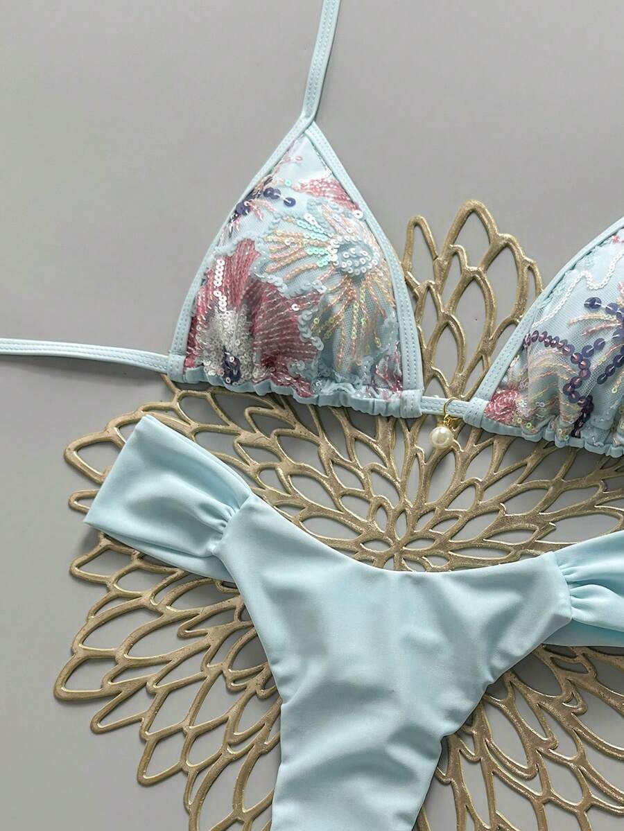 Women's 2-piece triangle cup bikini set in solid color featuring woven pearl shell decoration, halter neckline, and high-waist side-tie ruched bottoms.