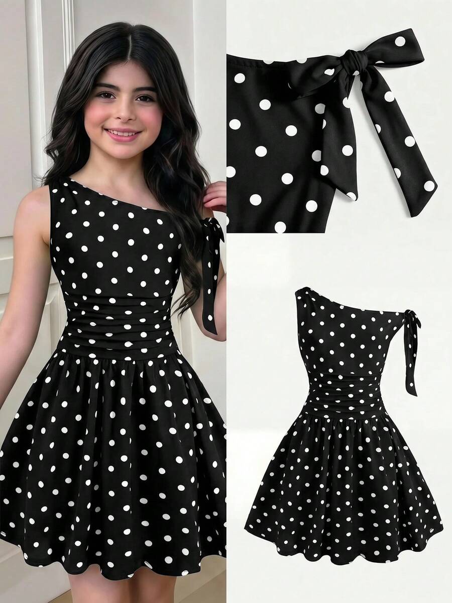 Tween girl wearing an apricot asymmetrical tiered sleeveless party dress with an A-line silhouette.