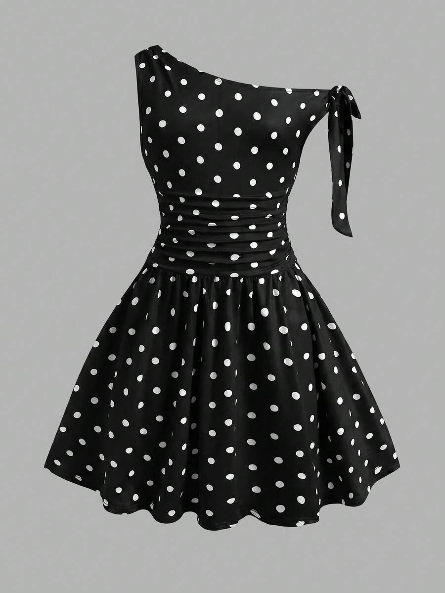 Tween girl wearing an apricot asymmetrical tiered sleeveless party dress with an A-line silhouette.