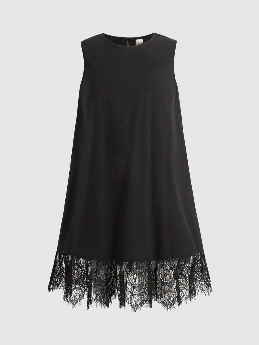 Tween girl wearing a sleeveless black tunic dress featuring a round neck, contrast lace details, and a straight hem.