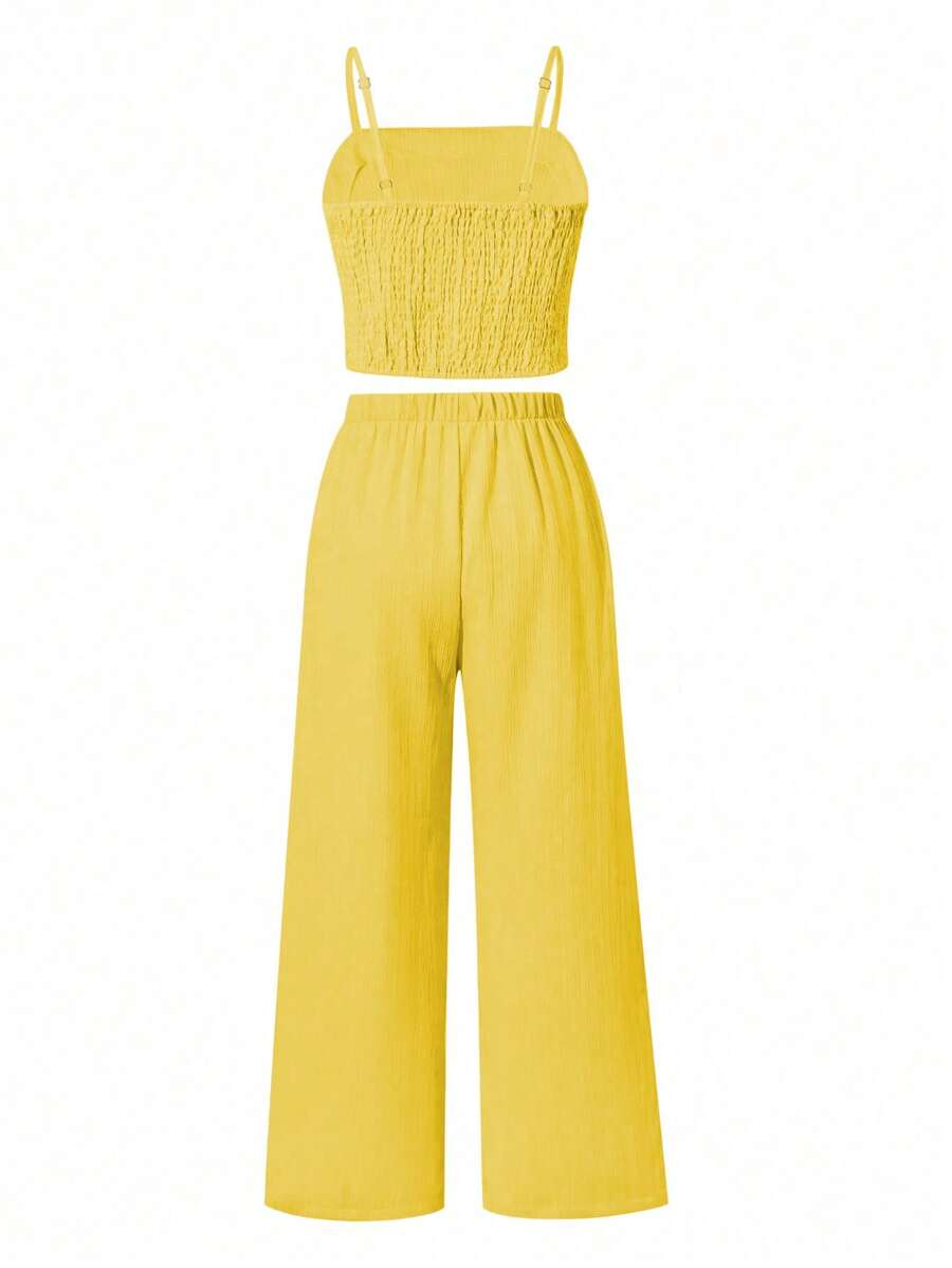 Tween girls casual 2-piece set featuring an apricot woven camisole crop top with back shirring and matching high-waisted loose long pants.
