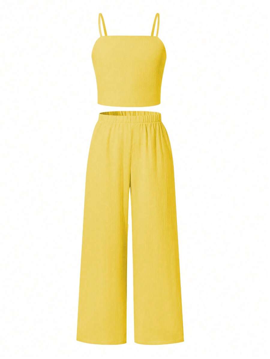 Tween girls casual 2-piece set featuring an apricot woven camisole crop top with back shirring and matching high-waisted loose long pants.