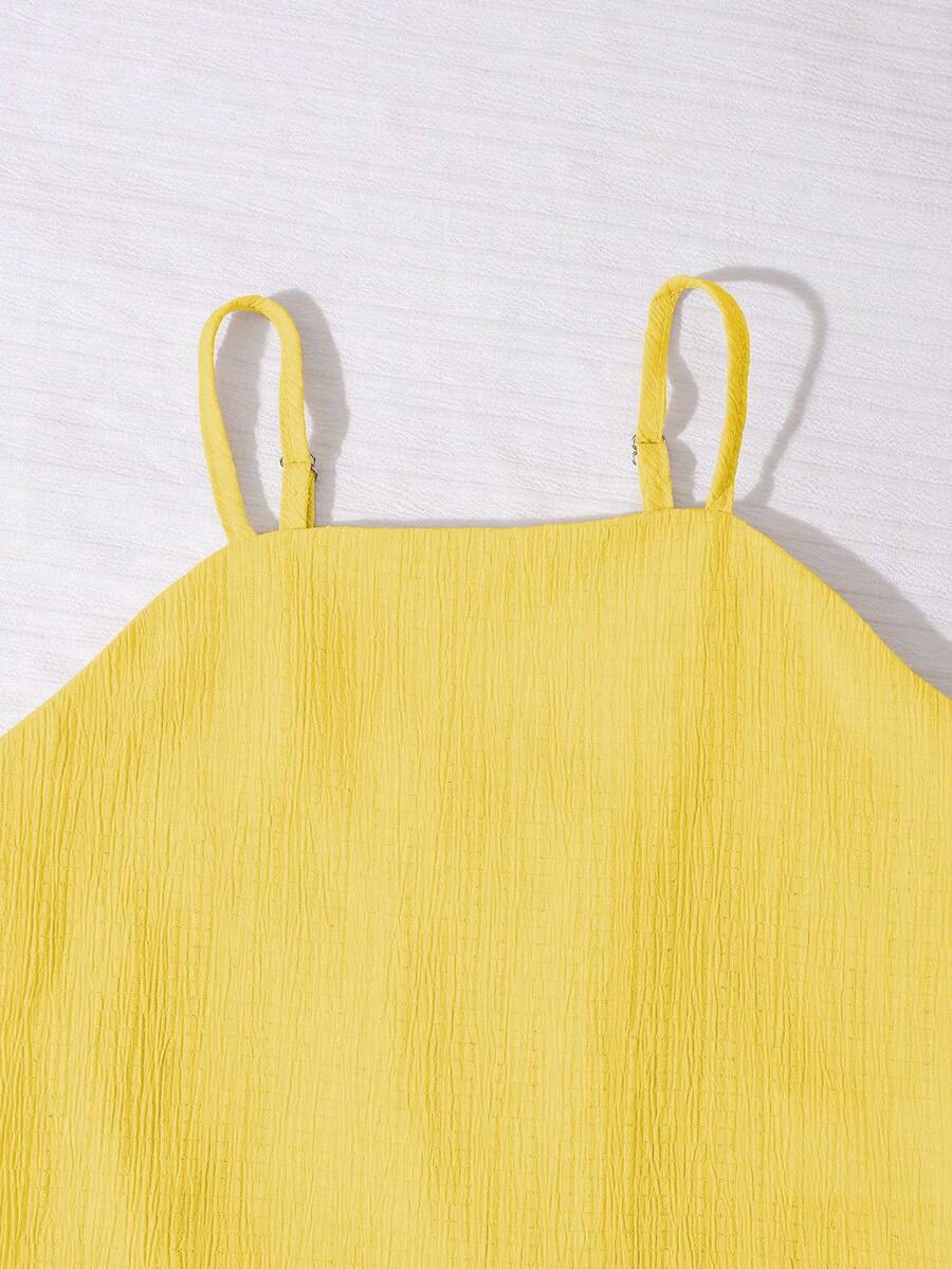 Tween girls casual 2-piece set featuring an apricot woven camisole crop top with back shirring and matching high-waisted loose long pants.