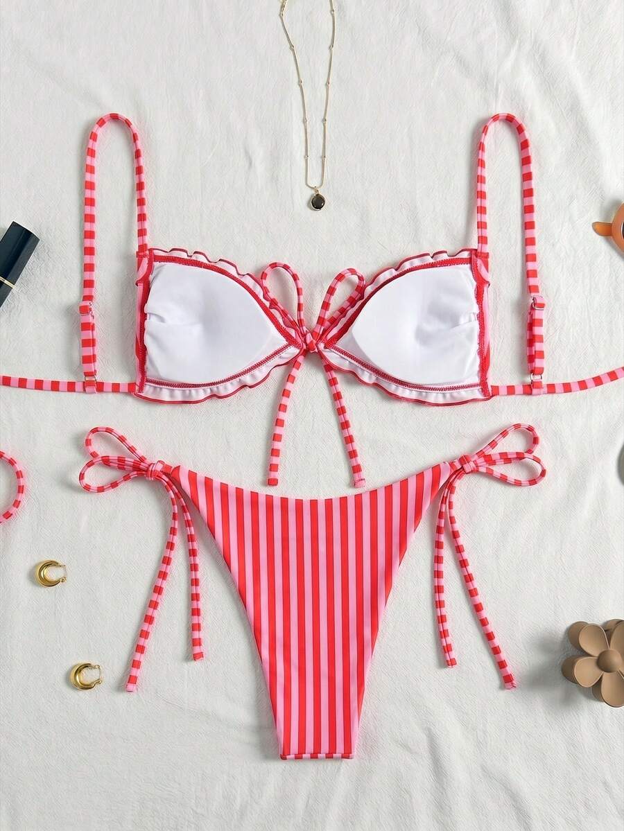 Women's beige two-piece bikini set featuring a wireless top with removable padding, spaghetti straps, tie back detail, and low waist hipster swimsuit bottoms.