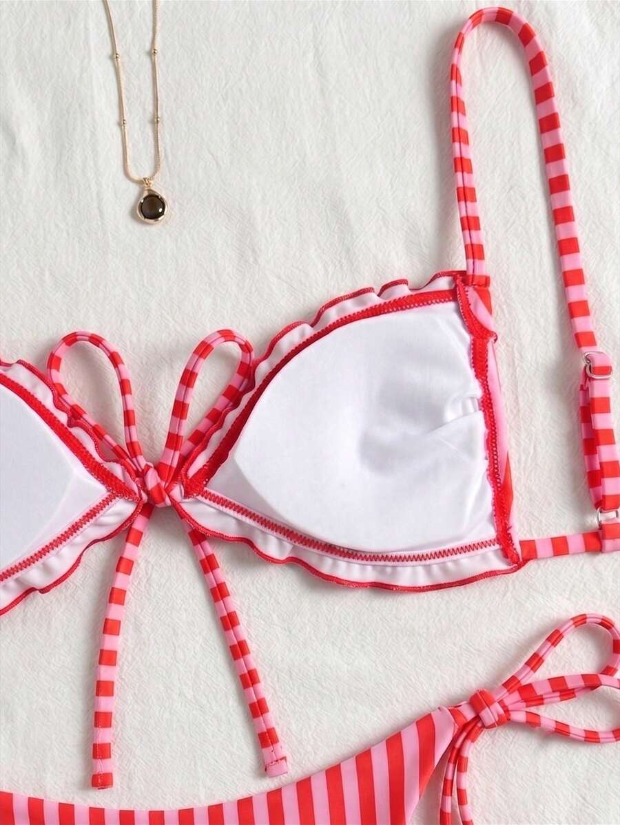 Women's beige two-piece bikini set featuring a wireless top with removable padding, spaghetti straps, tie back detail, and low waist hipster swimsuit bottoms.