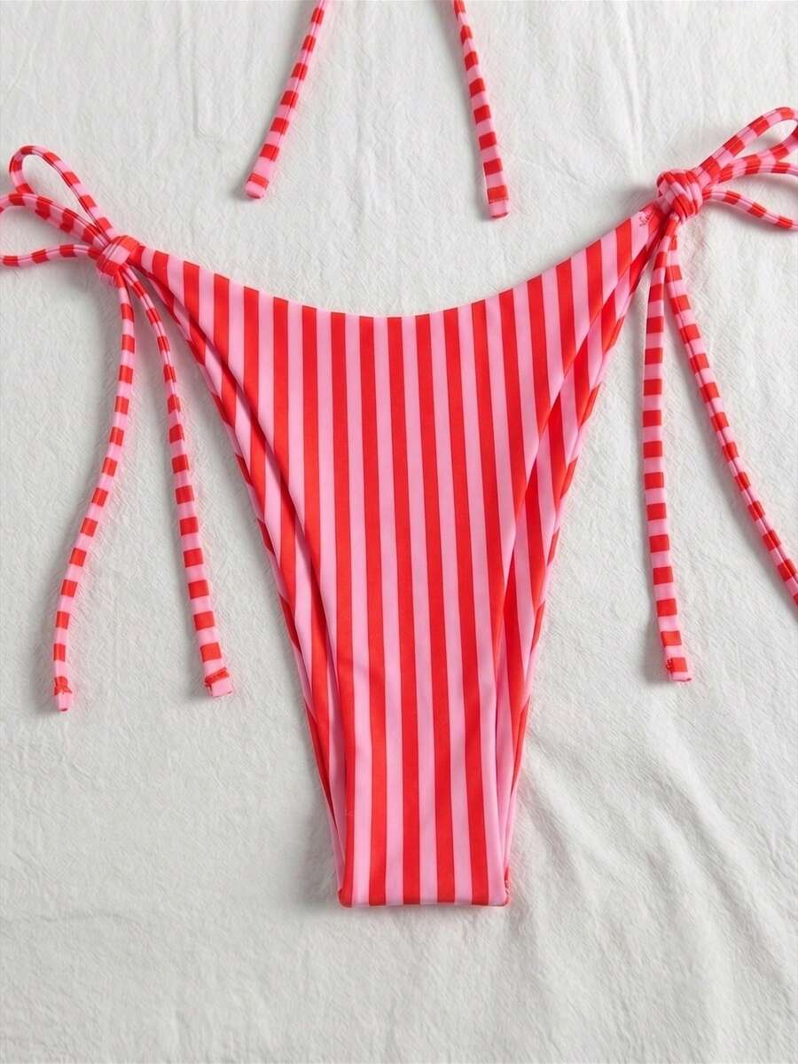 Women's beige two-piece bikini set featuring a wireless top with removable padding, spaghetti straps, tie back detail, and low waist hipster swimsuit bottoms.