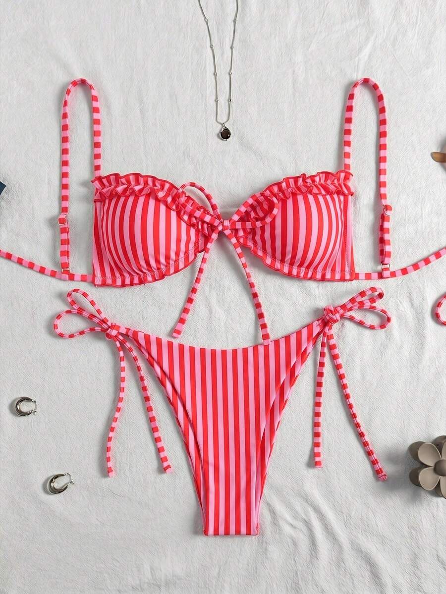 Women's beige two-piece bikini set featuring a wireless top with removable padding, spaghetti straps, tie back detail, and low waist hipster swimsuit bottoms.