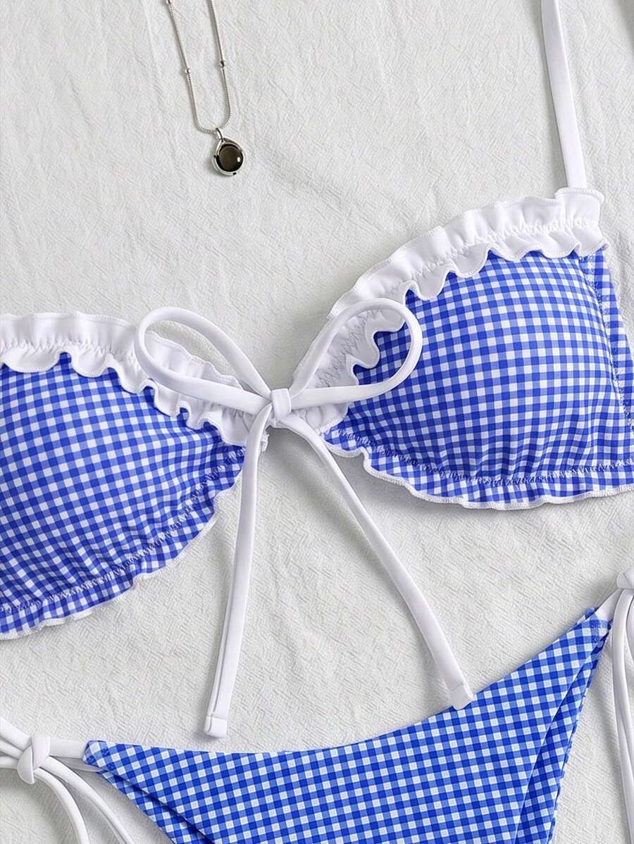 Women's beige two-piece bikini set featuring a wireless top with removable padding, spaghetti straps, tie back detail, and low waist hipster swimsuit bottoms.