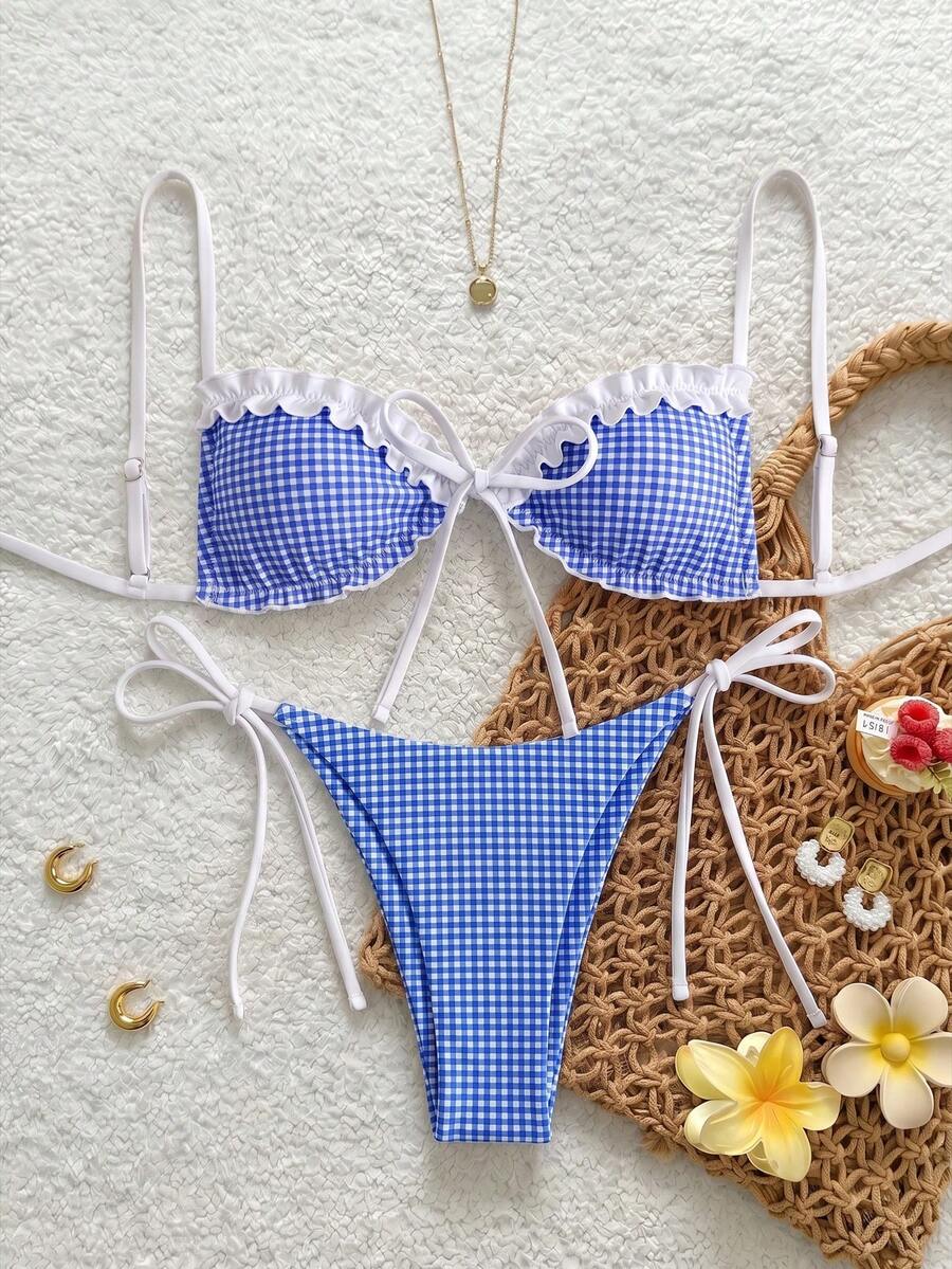 Women's beige two-piece bikini set featuring a wireless top with removable padding, spaghetti straps, tie back detail, and low waist hipster swimsuit bottoms.