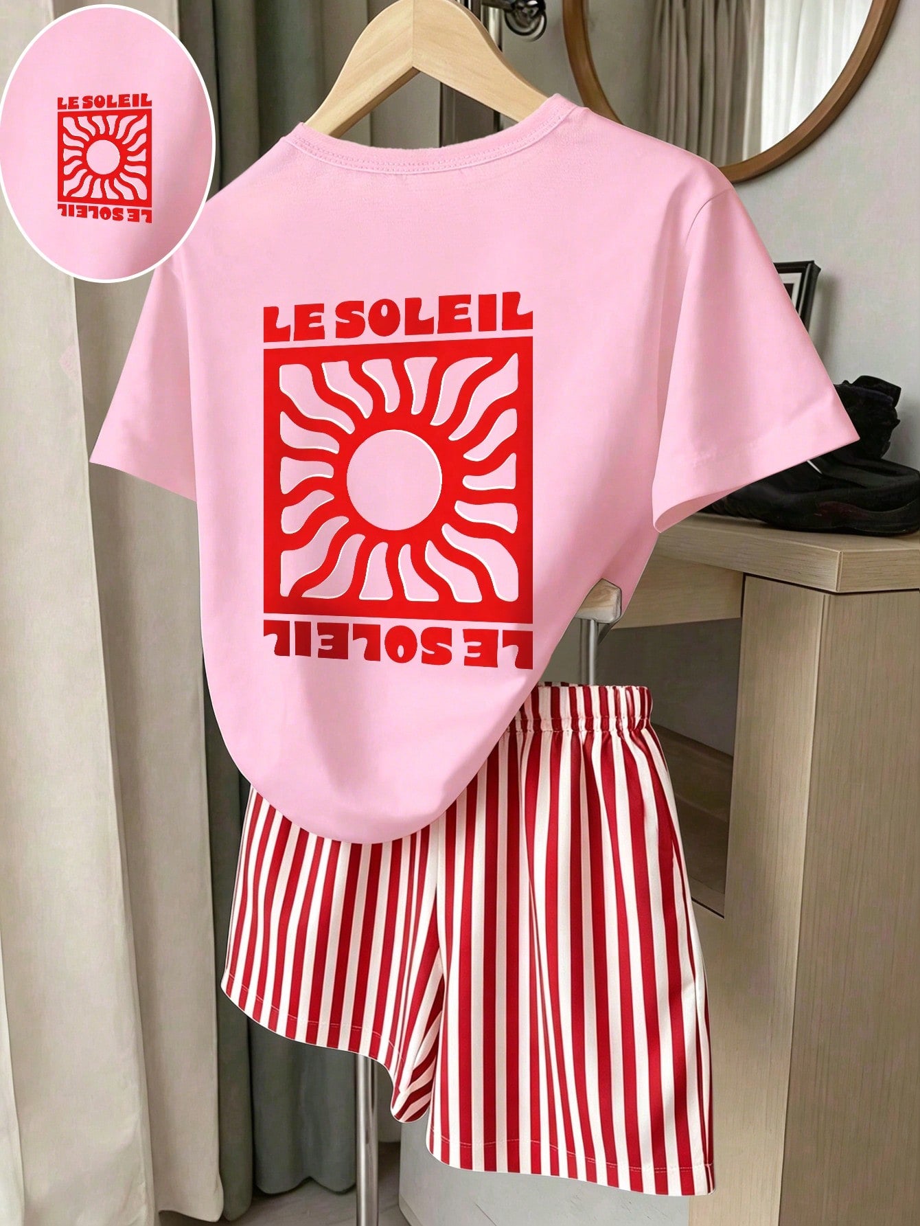 Girls' multicolor short sleeve T-shirt and shorts set featuring a cute cherry and bow print with round neck top and matching shorts.