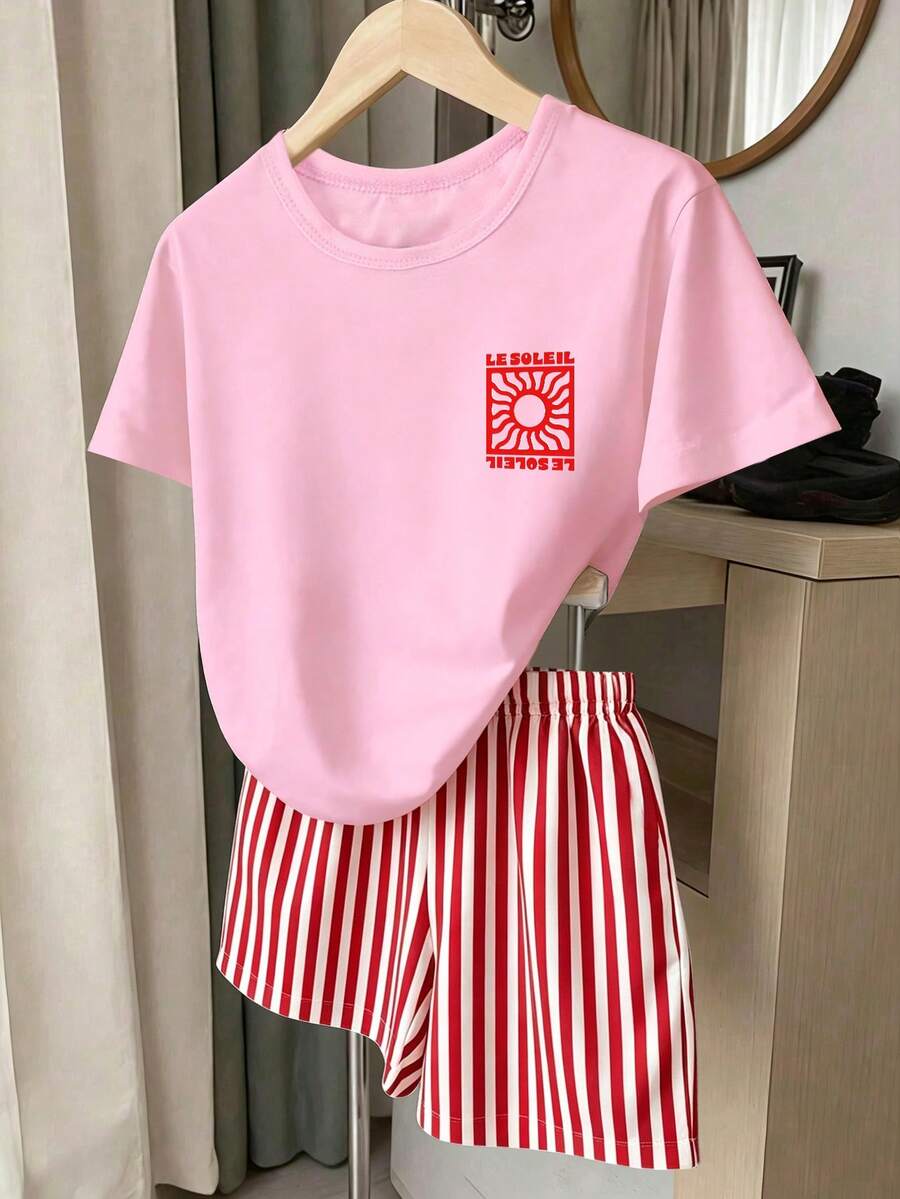 Girls' multicolor short sleeve T-shirt and shorts set featuring a cute cherry and bow print with round neck top and matching shorts.