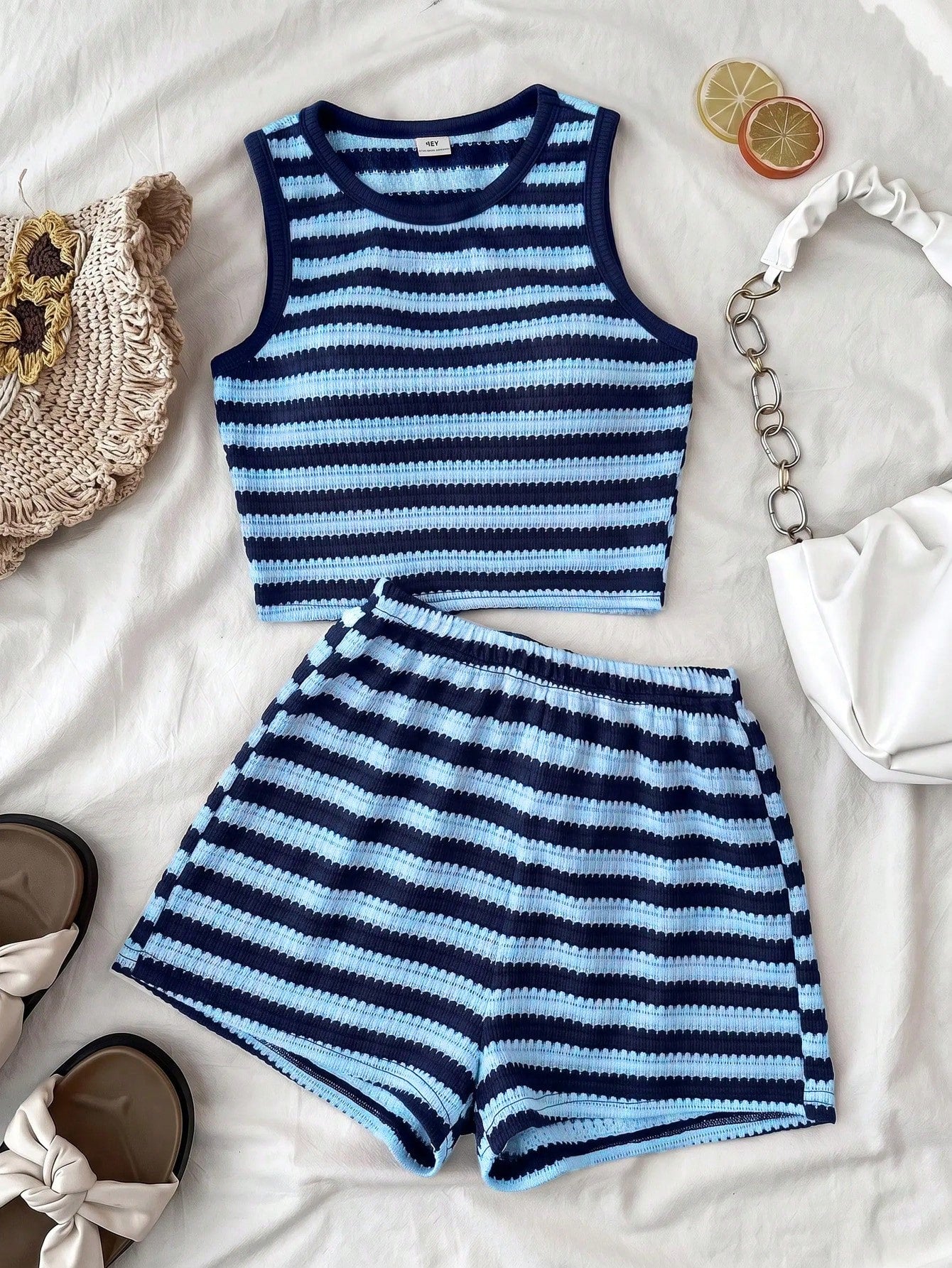 Tween girls black and white two-piece casual summer outfit featuring a rib-knit cropped top with round neck and matching shorts with contrast piping.