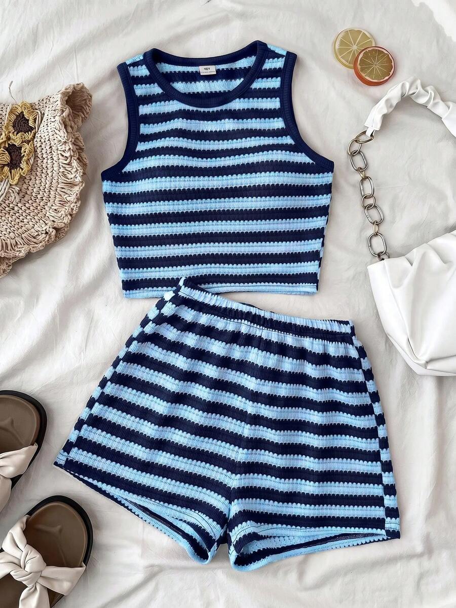 Tween girls black and white two-piece casual summer outfit featuring a rib-knit cropped top with round neck and matching shorts with contrast piping.