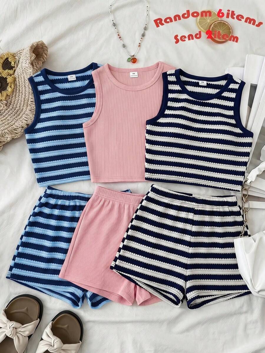 Tween girls black and white two-piece casual summer outfit featuring a rib-knit cropped top with round neck and matching shorts with contrast piping.