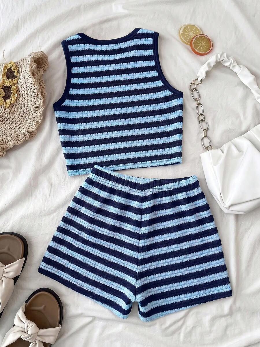 Tween girls black and white two-piece casual summer outfit featuring a rib-knit cropped top with round neck and matching shorts with contrast piping.