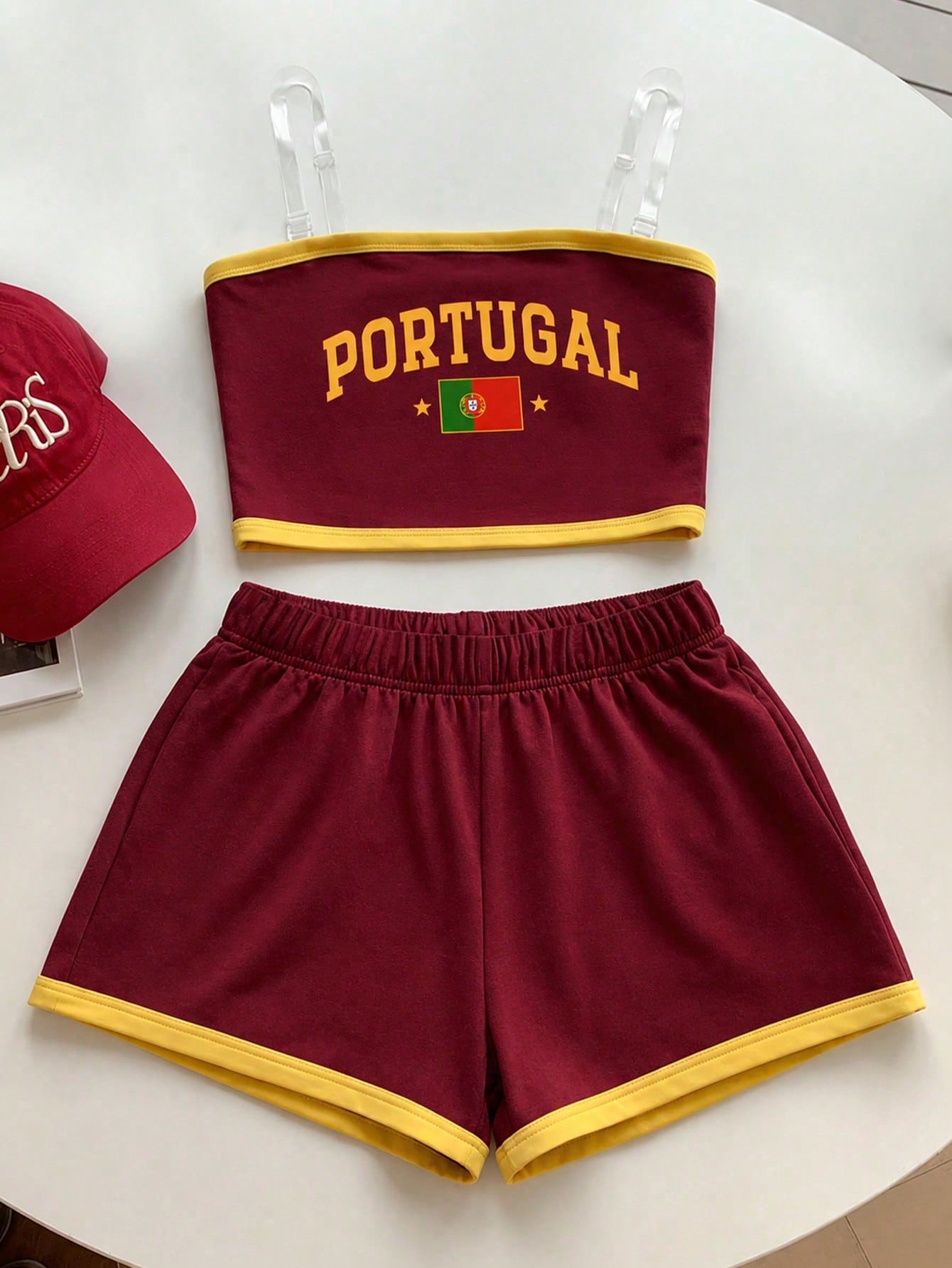 Tween girls two-piece summer outfit featuring a brown strapless tube top with contrast pink tape accent and matching brown shorts with pockets.