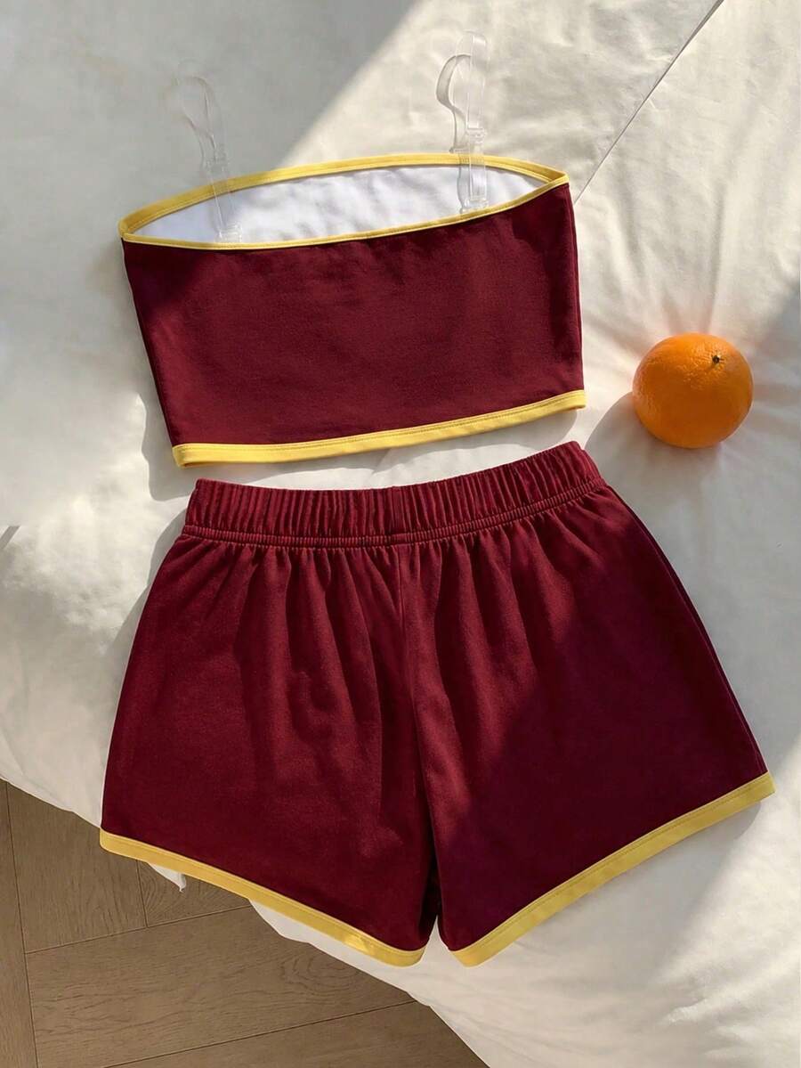 Tween girls two-piece summer outfit featuring a brown strapless tube top with contrast pink tape accent and matching brown shorts with pockets.